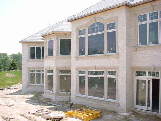 Brick and stone get installed at the Aboite Cliffs Virtual Villaminium